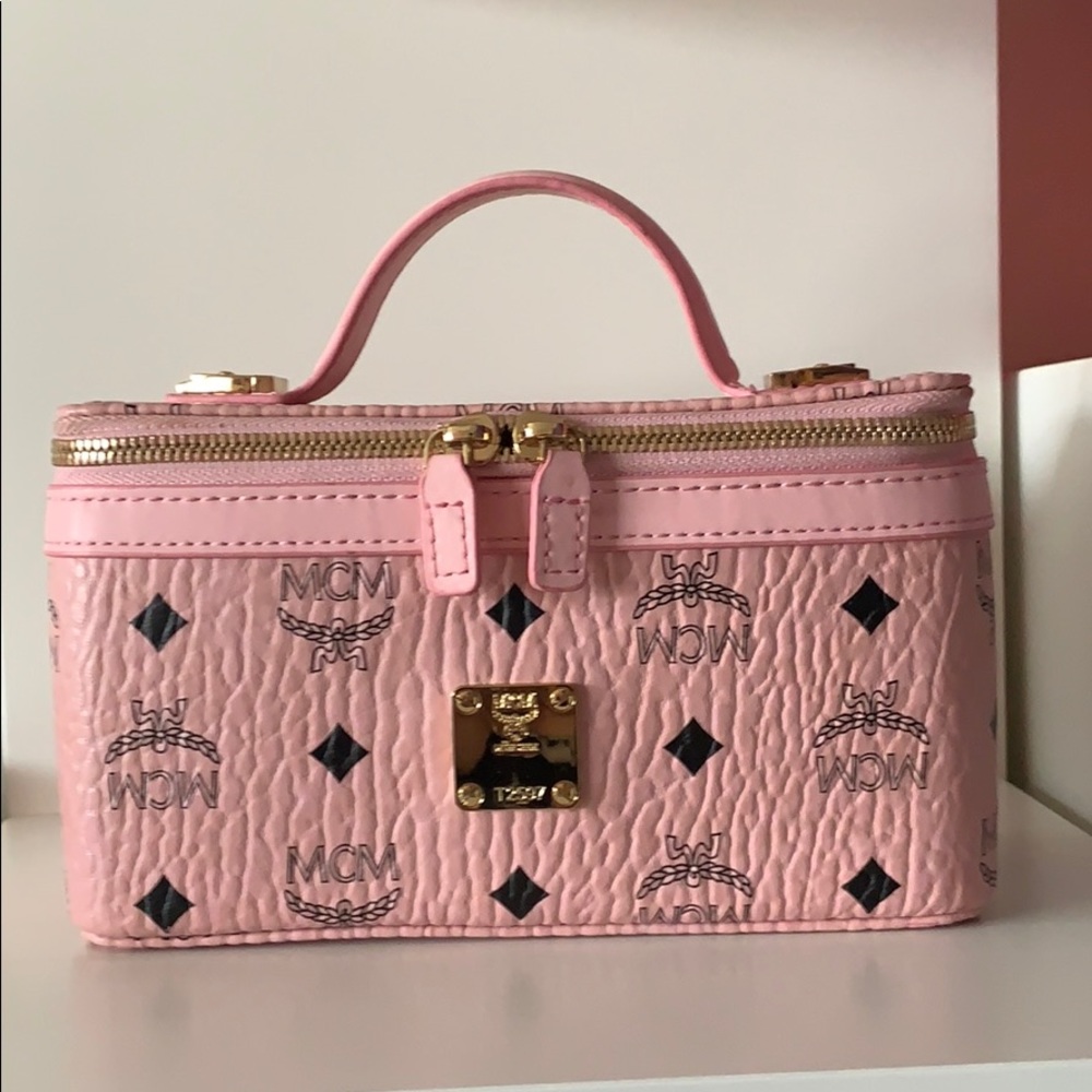 Pink mcm bag with shoulder strap